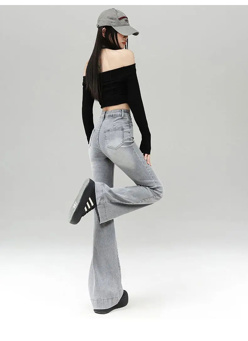 Light gray denim slightly flared pants for women with a distinctive belt, casual trendy fashion