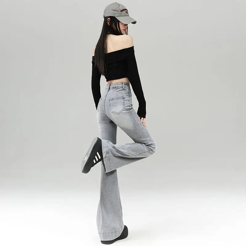 Light gray denim slightly flared pants for women with a distinctive belt, casual trendy fashion
