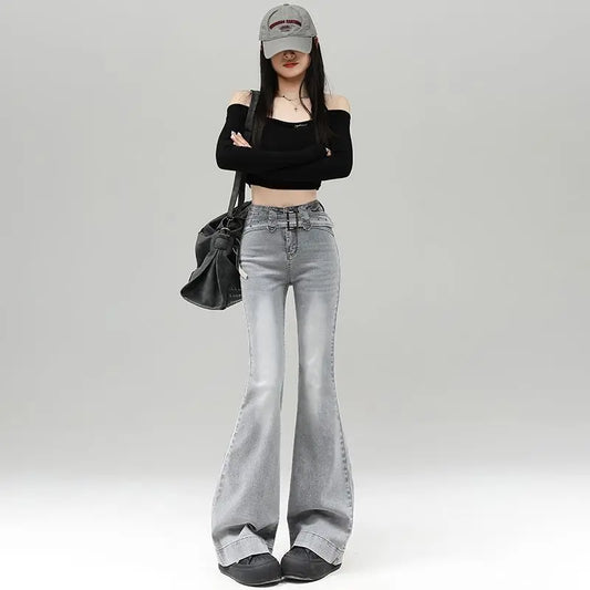 Light gray denim slightly flared pants for women with a distinctive belt, casual trendy fashion